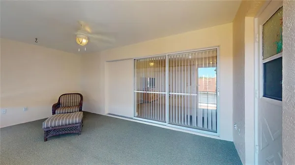 a kitchen with a table chairs sink and cabinets