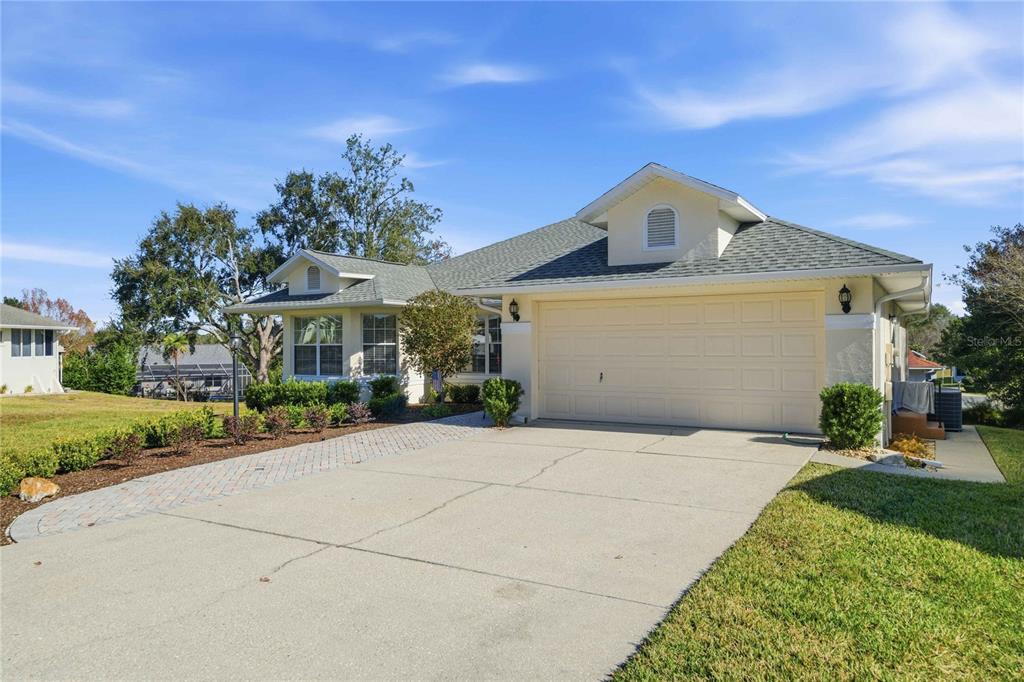 4427 North Bacall Loop Beverly Hills, FL 34465 - Photo 32 of 41 front view of a house with a yard