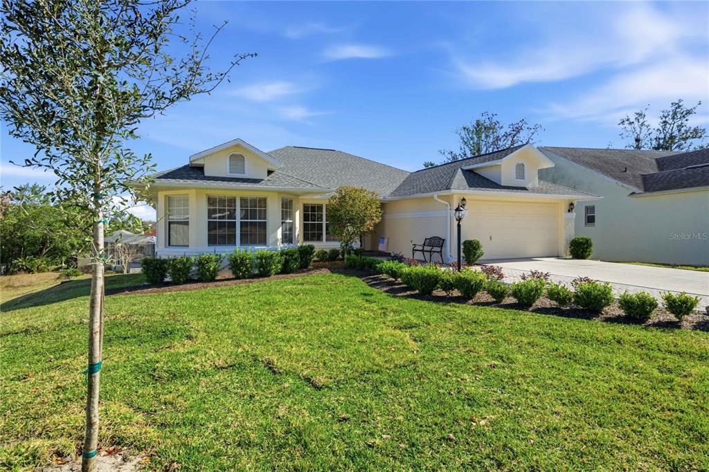 4427 North Bacall Loop Beverly Hills, FL 34465 - Photo 35 of 41 a front view of a house with a yard