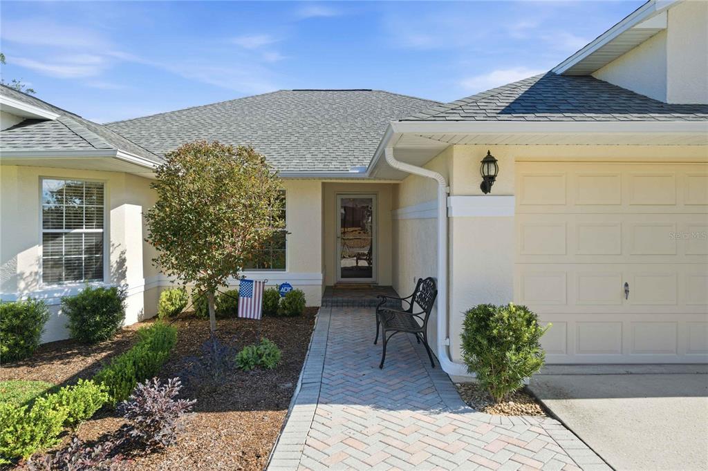 4427 North Bacall Loop Beverly Hills, FL 34465 - Photo 36 of 41 a front view of a house with garden