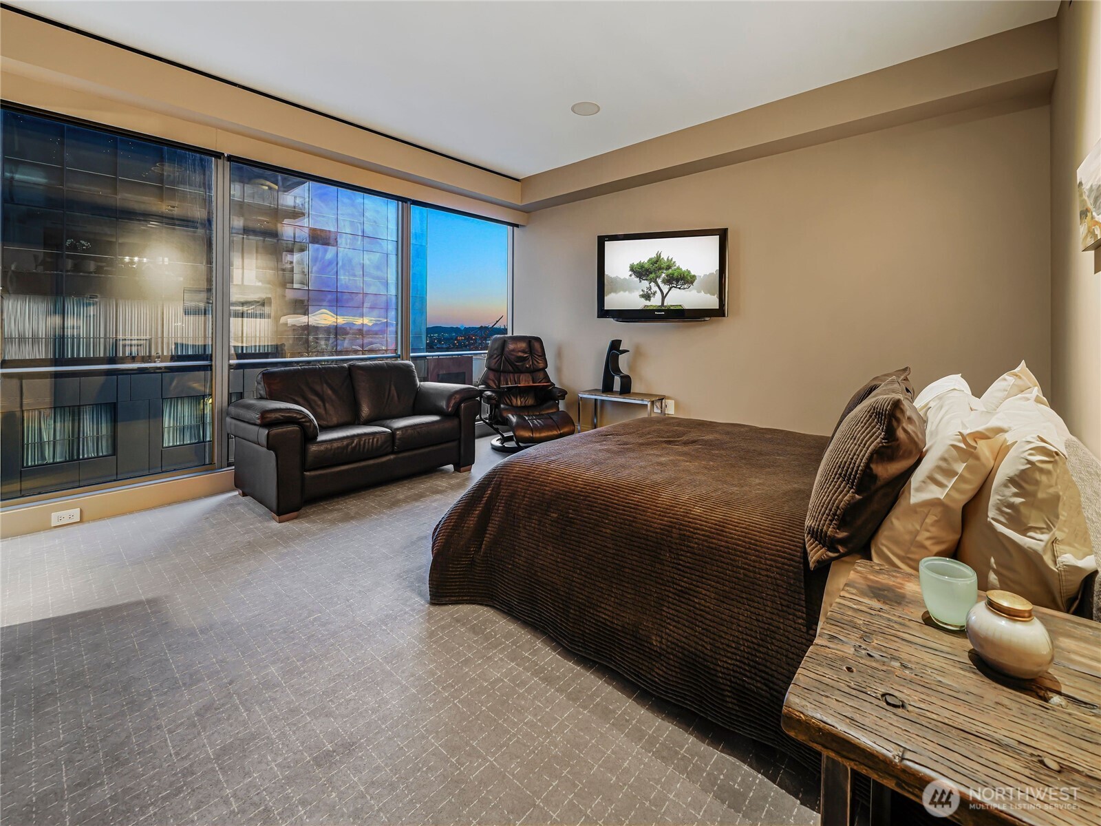 99 Union Street, Unit 1102 Seattle, WA 98101 - Photo 15 of 36 a bed room with a bed and a couch