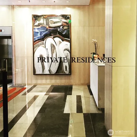 a table with a vase and flowers on it