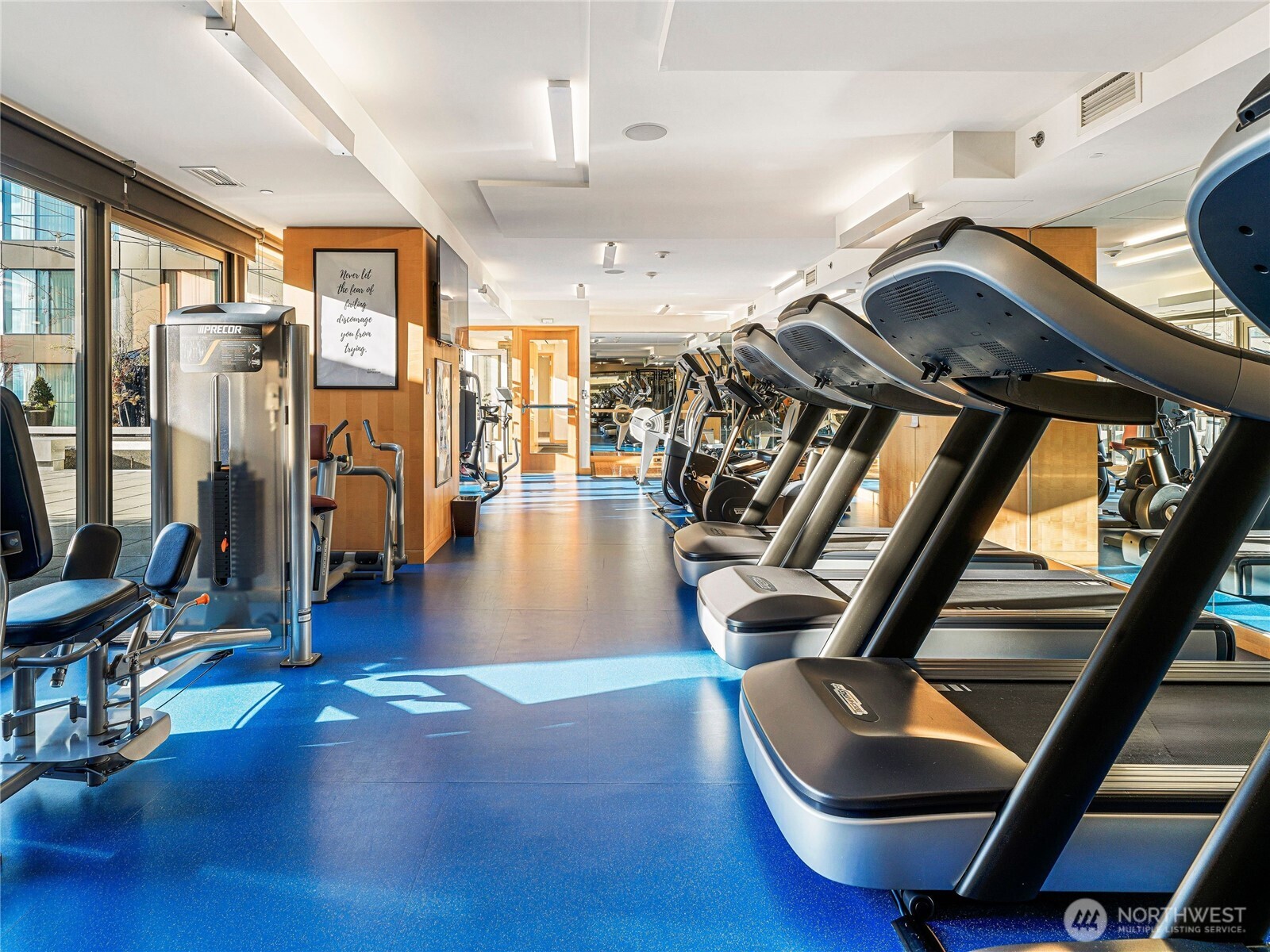 99 Union Street, Unit 1102 Seattle, WA 98101 - Photo 29 of 36 a gym room with lots of gym equipment