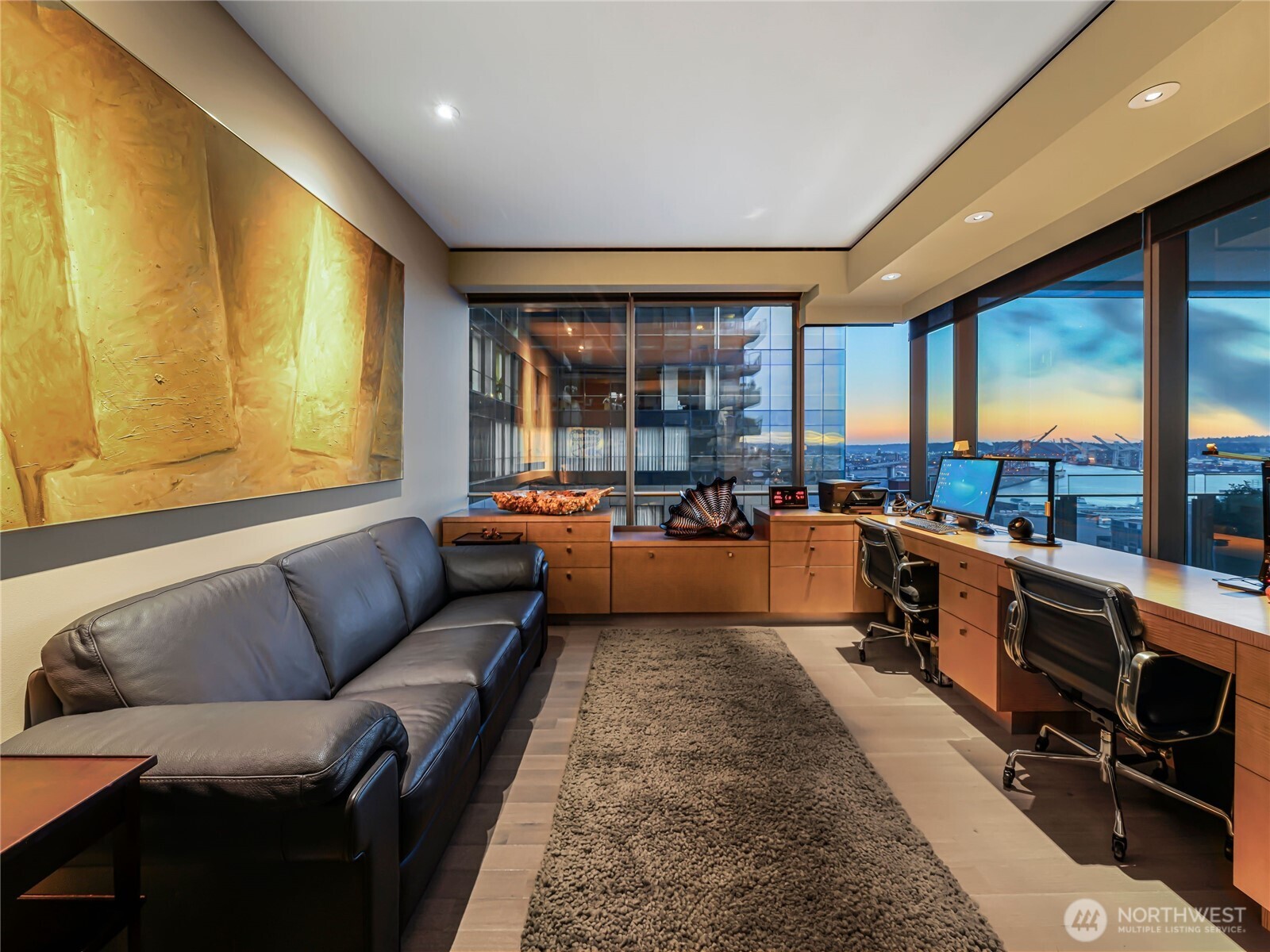 99 Union Street, Unit 1102 Seattle, WA 98101 - Photo 9 of 36 a living room with furniture and a large window