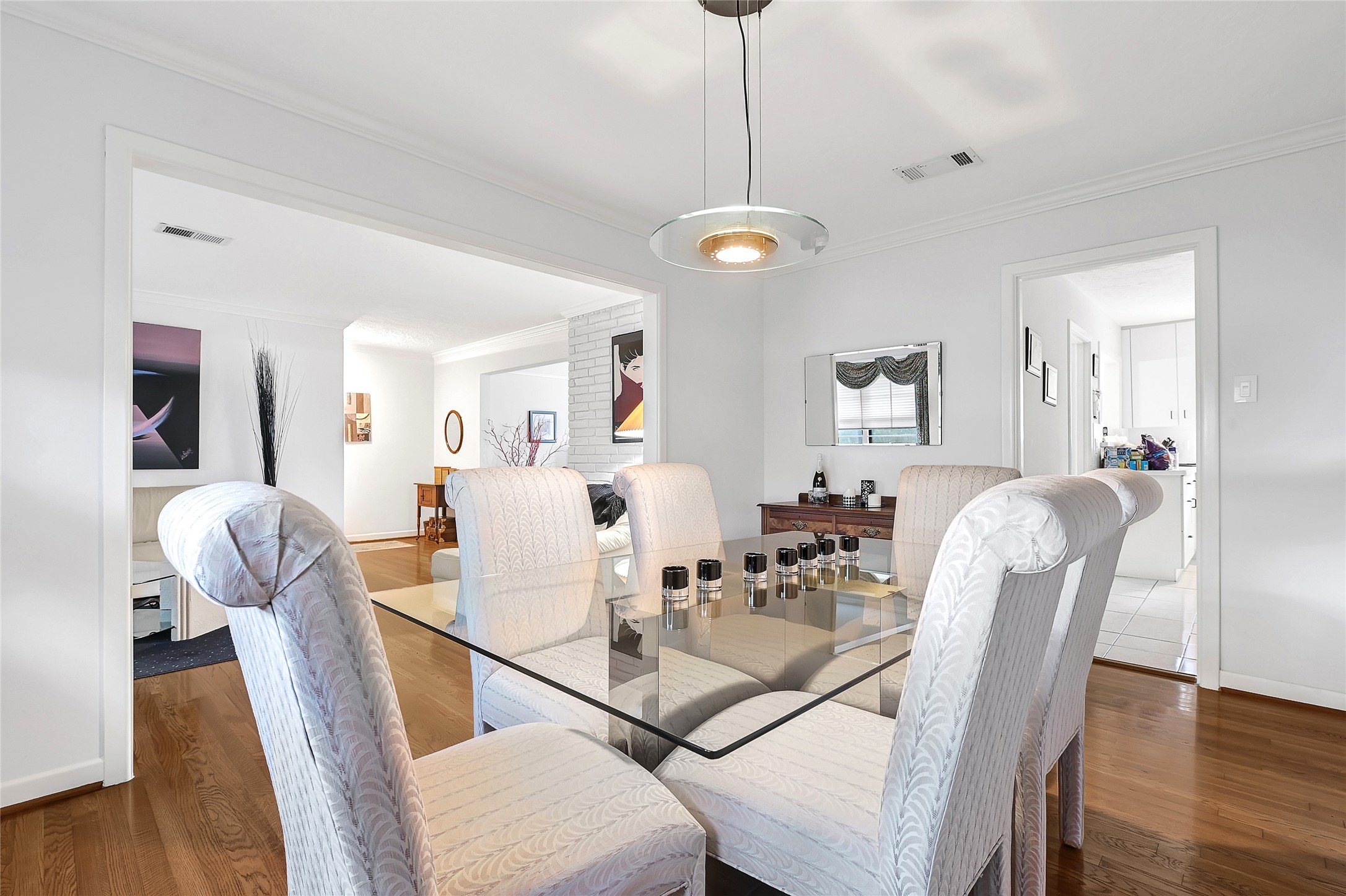 4831 Knickerbocker Street Houston, TX 77035 - Photo 15 of 50 Formal dining room with elegant décor, open layout, and hardwood floors.