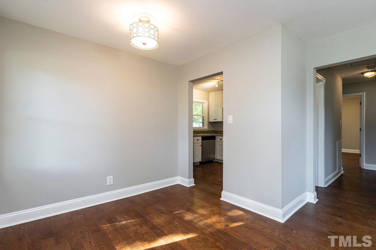 1105 Brighton Road Raleigh, NC 27610 - Photo 7 of 22 wooden floor in an empty room with a window