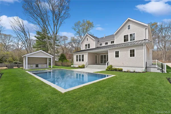 an aerial view of a house with outdoor space