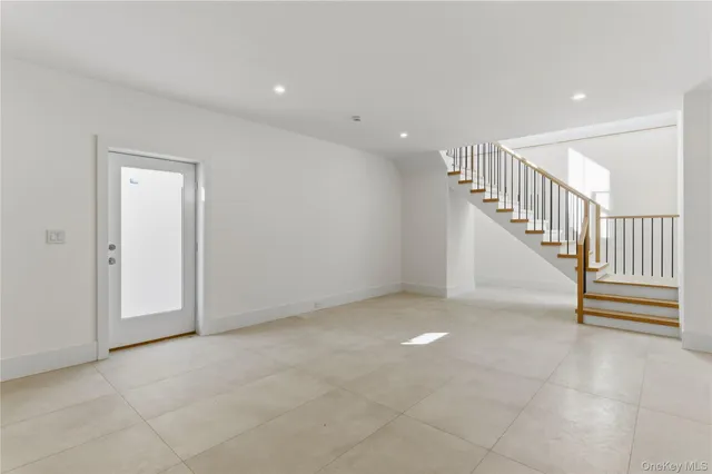 a view of an empty room with stairs