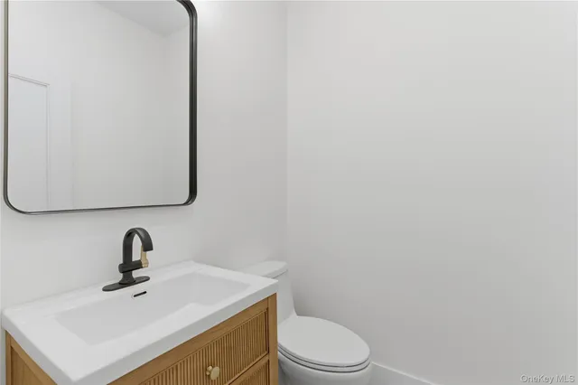 a front view of a house with a yard table and chairs
