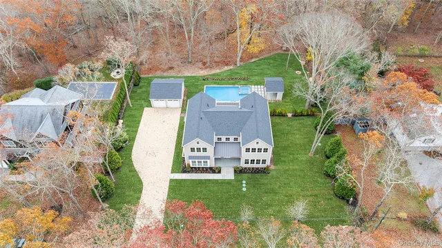 an aerial view of a house with outdoor space