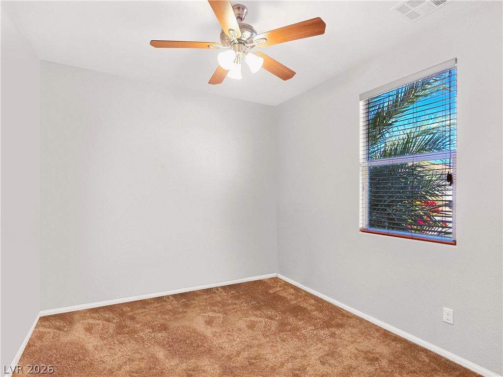 2485 Morrow Ridge Place Laughlin, NV 89029 - Photo 20 of 40 A quiet space featuring a window and ceiling fan for optimal comfort.