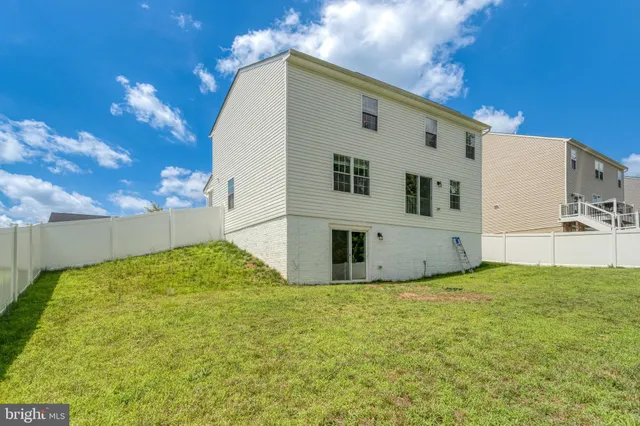 a view of a backyard of the house