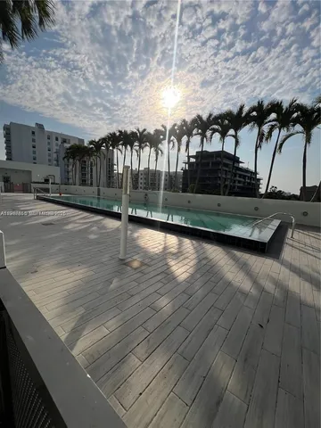 a view of swimming pool with outdoor seating and stairs
