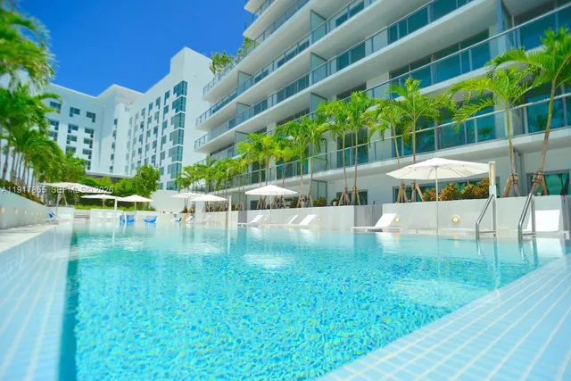 a view of yard with swimming pool and outdoor seating