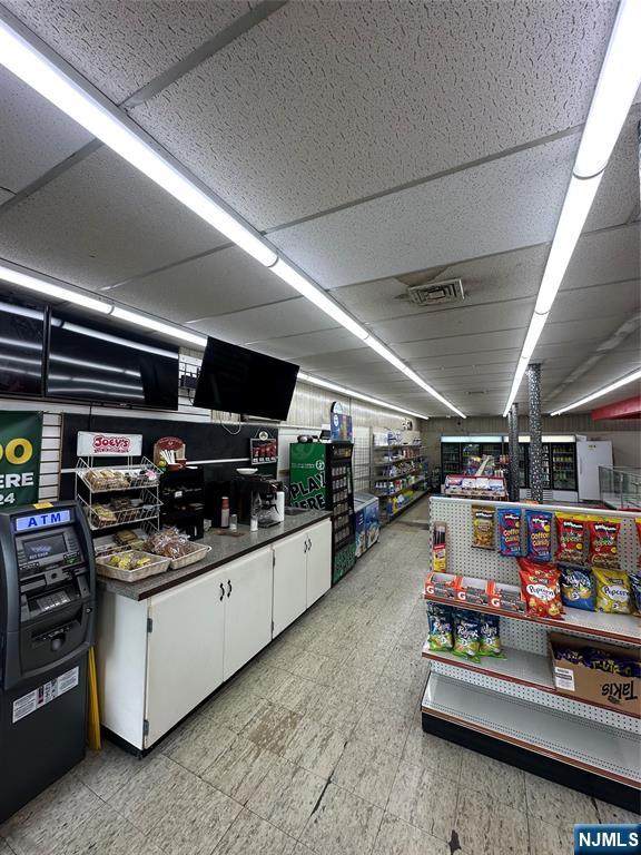 213 Van Winkle Avenue Hawthorne, NJ 07506 - Photo 4 of 7 a storage room with washer and dryer