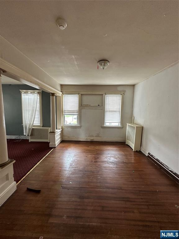 213 Van Winkle Avenue Hawthorne, NJ 07506 - Photo 6 of 7 a view of empty room with wooden floor and fan