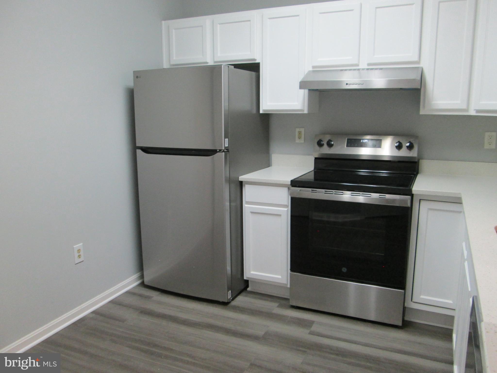 2004 Travis Point Court Odenton, MD 21113 - Photo 2 of 14 a stove top oven sitting inside of a kitchen