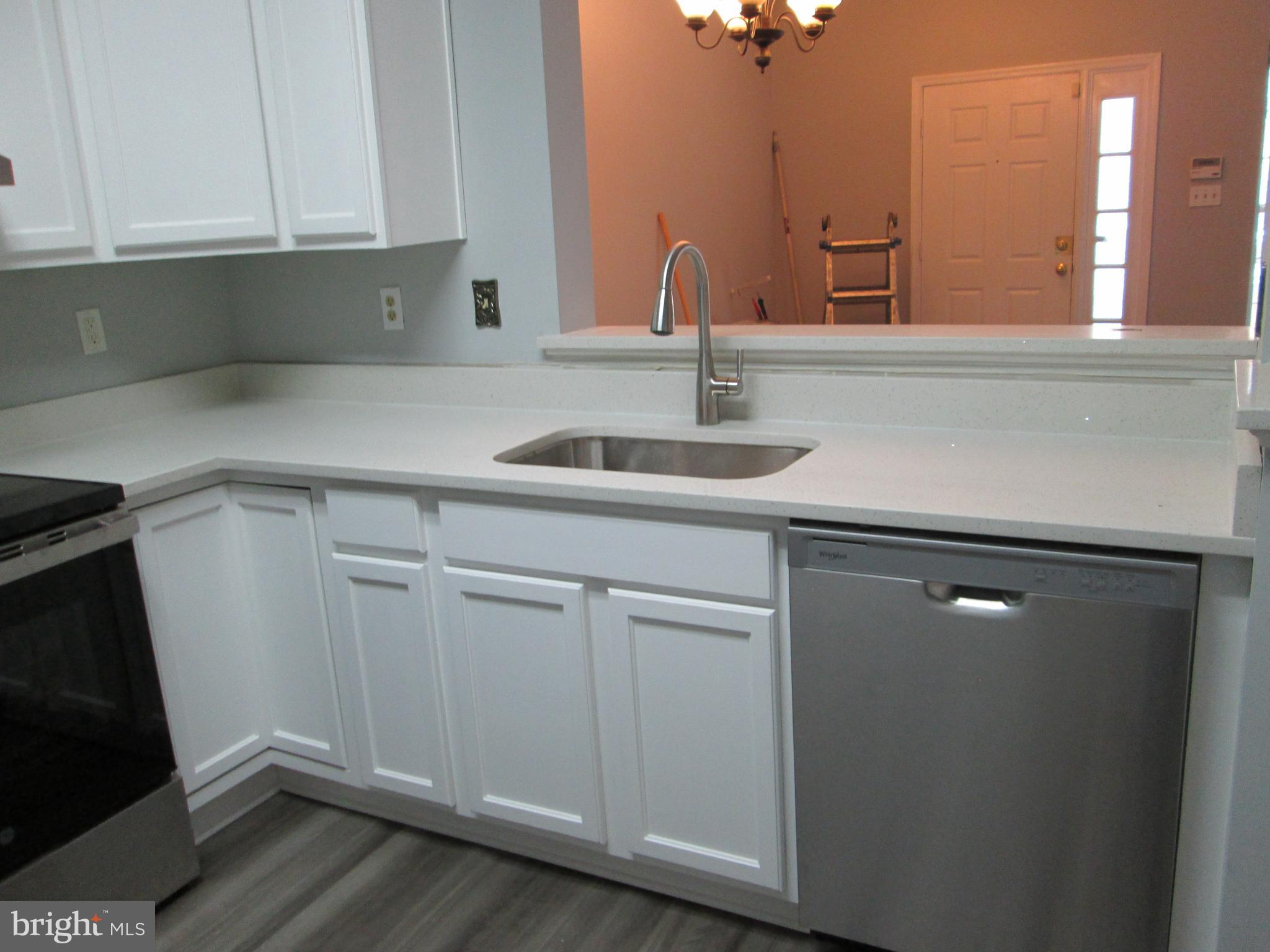 2004 Travis Point Court Odenton, MD 21113 - Photo 6 of 14 a kitchen with a sink and cabinets