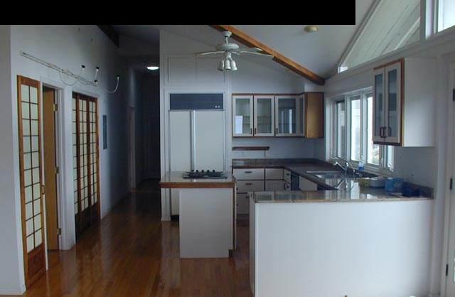 772 Naalae Road, Unit COTTAGE ADDRESS: 802 Kula, HI 96790 - Photo 6 of 11 a kitchen with stainless steel appliances granite countertop a refrigerator and a sink