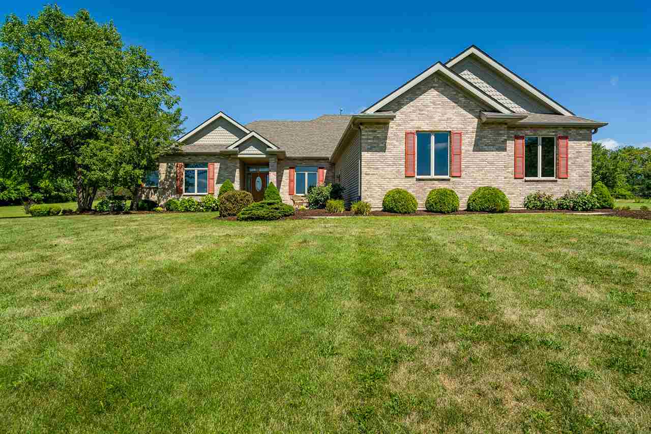 80 North Creek Road Roscoe, IL 61073 - Photo 1 of 25 a front of a house with a yard and trees