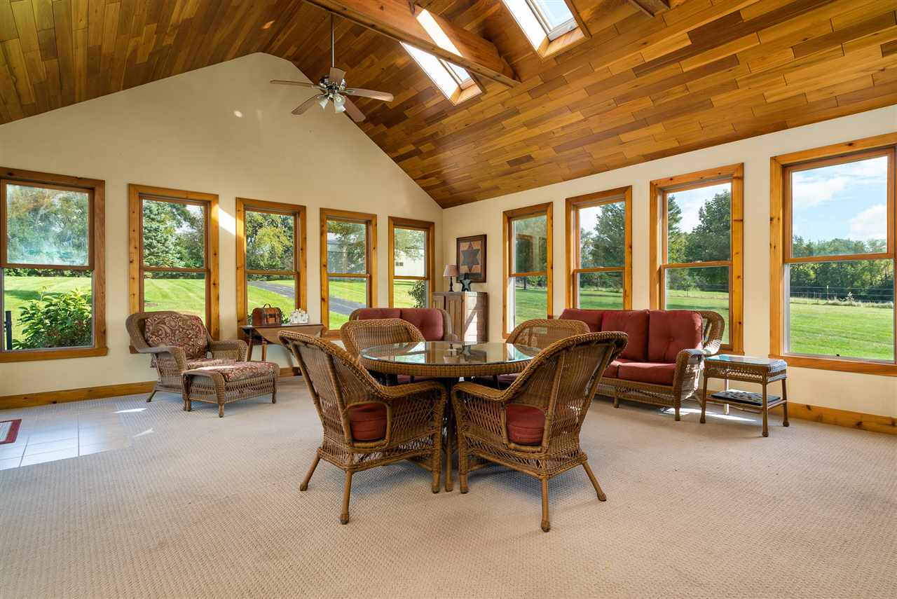 80 North Creek Road Roscoe, IL 61073 - Photo 15 of 25 a dining room with furniture water view and a mountain view