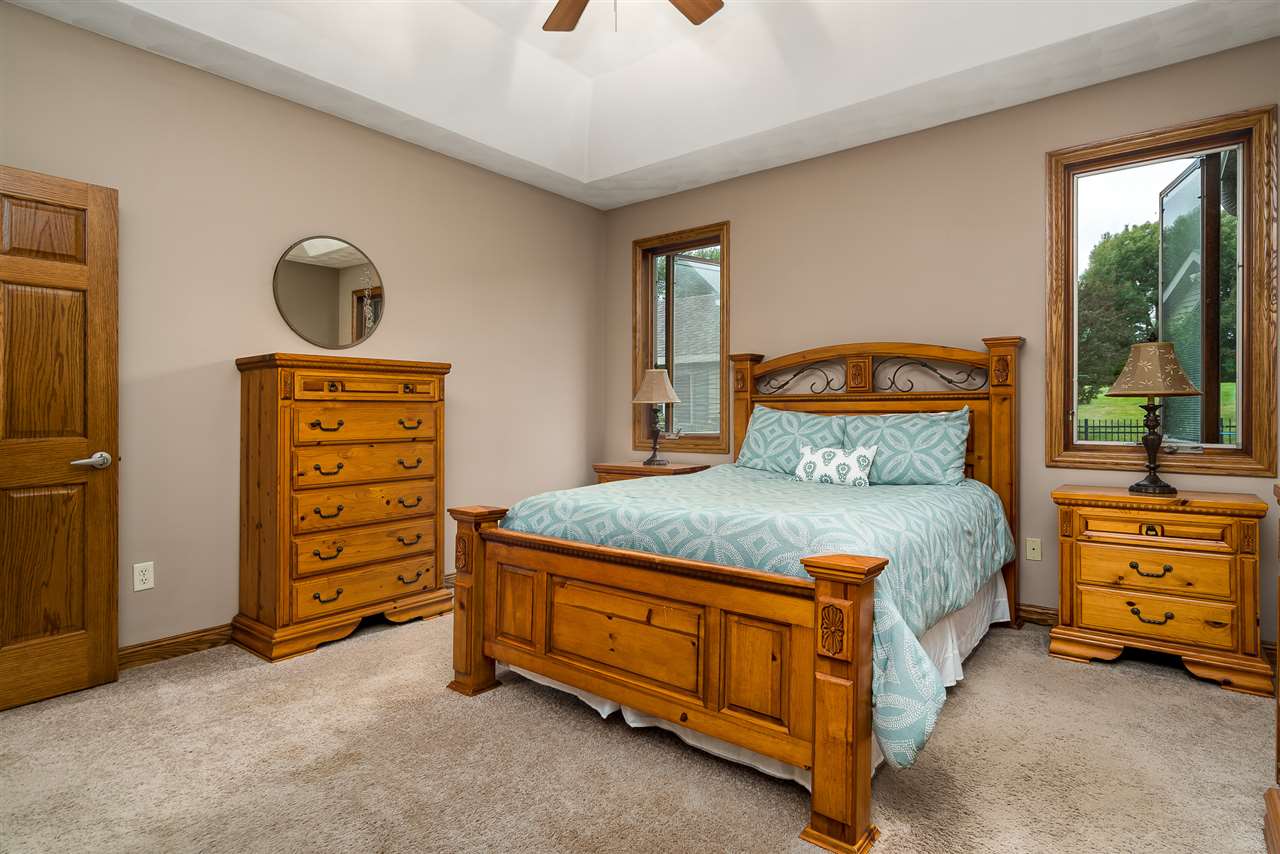 80 North Creek Road Roscoe, IL 61073 - Photo 16 of 25 a bedroom with a bed and a dresser