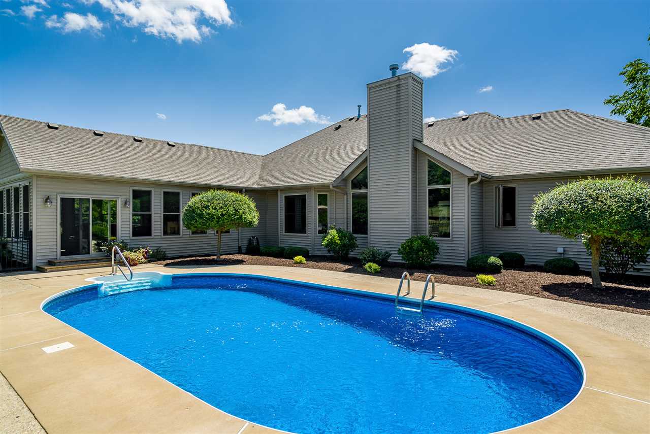 80 North Creek Road Roscoe, IL 61073 - Photo 22 of 25 a view of a house with swimming pool and porch with furniture