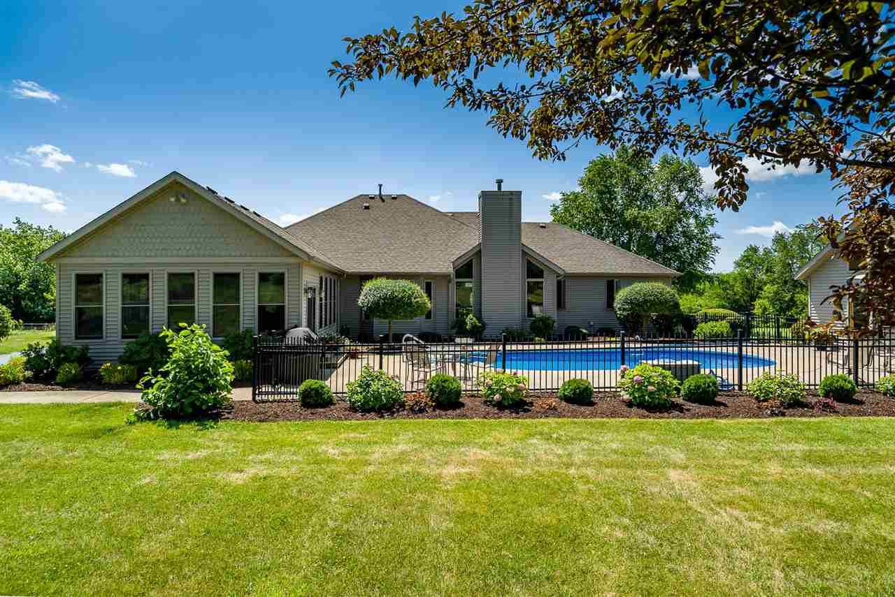 80 North Creek Road Roscoe, IL 61073 - Photo 23 of 25 a front view of house with yard and seating area