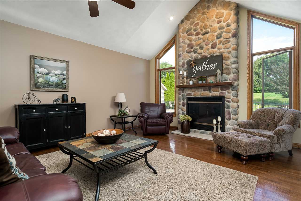 80 North Creek Road Roscoe, IL 61073 - Photo 6 of 25 a living room with furniture and a fireplace