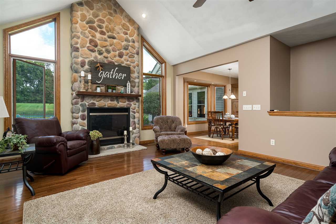 80 North Creek Road Roscoe, IL 61073 - Photo 7 of 25 a living room with furniture and a fireplace