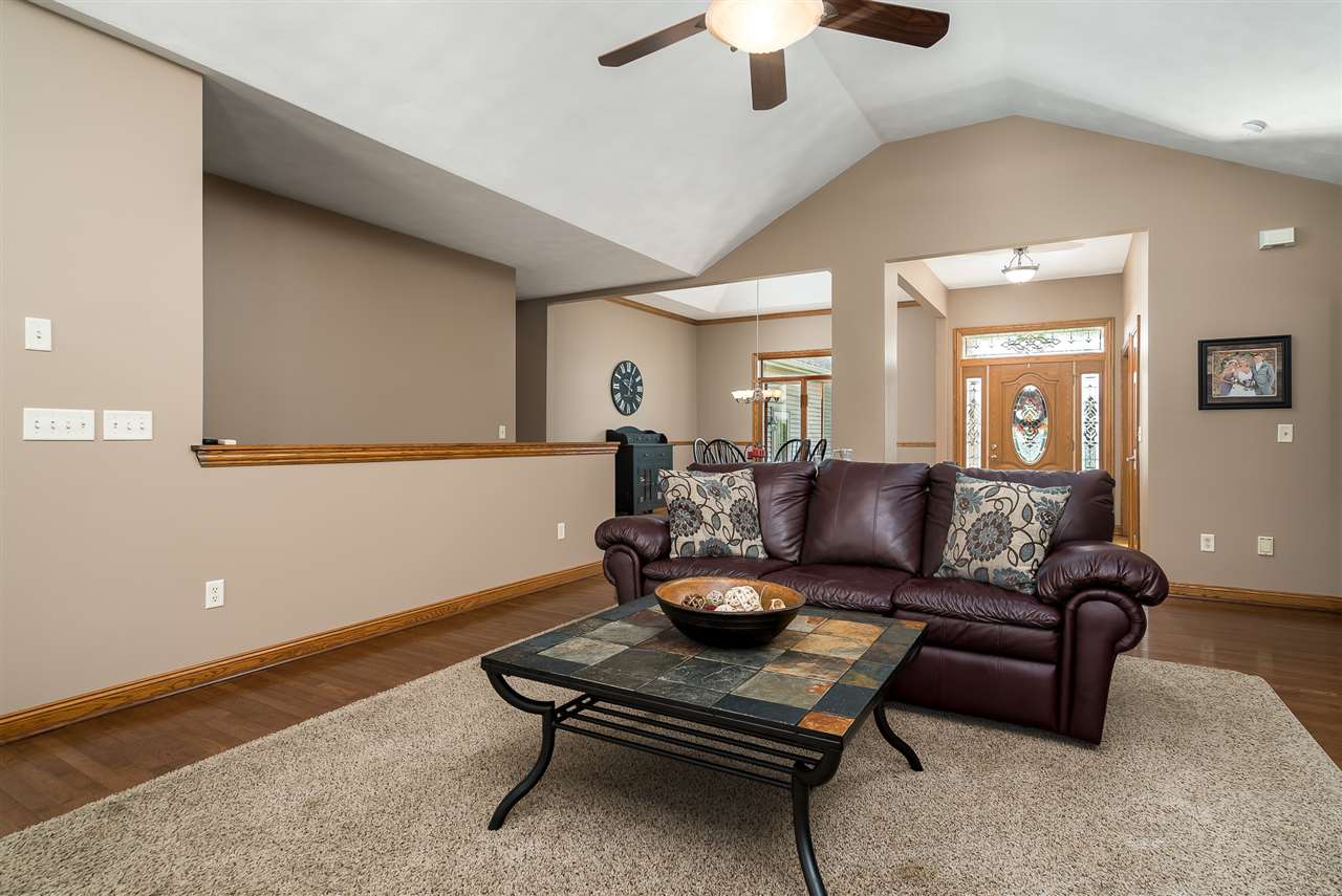 80 North Creek Road Roscoe, IL 61073 - Photo 8 of 25 a living room with furniture and a chandelier