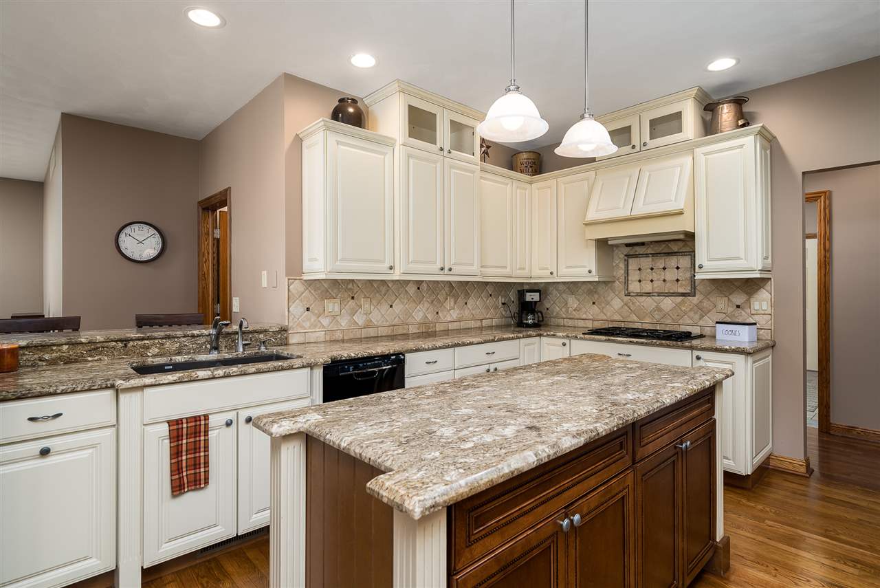 80 North Creek Road Roscoe, IL 61073 - Photo 10 of 25 a kitchen with a center island appliances and cabinets