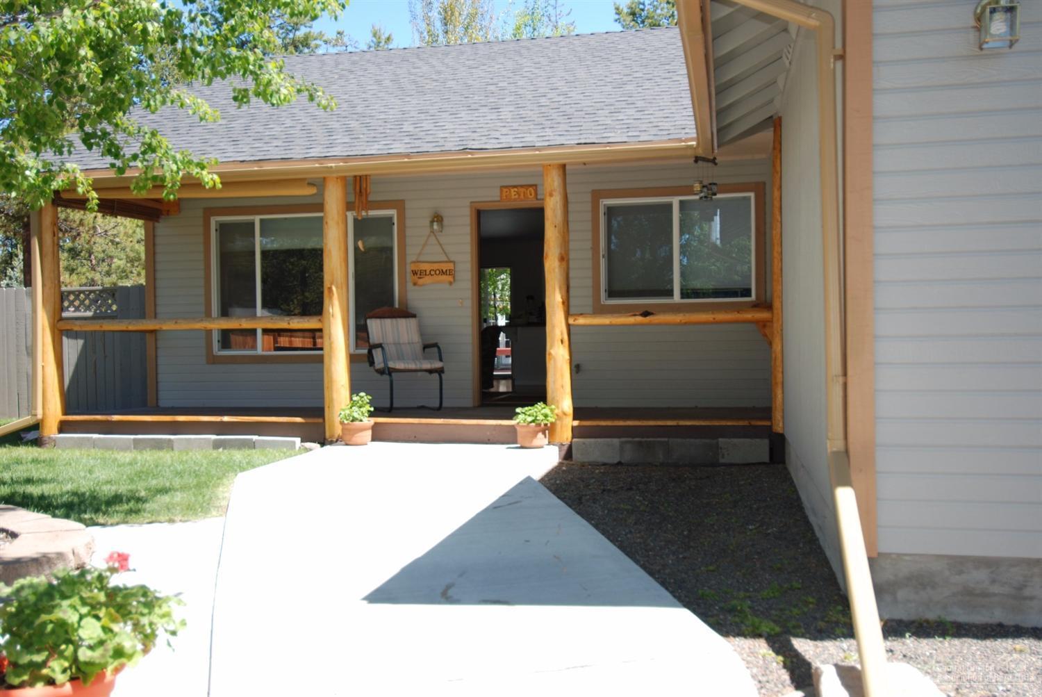 55726 Snow Goose Road Bend, OR 97707 - Photo 3 of 25 a view of a house with door