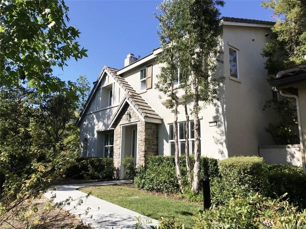 23 Bedstraw Loop Ladera Ranch, CA 92694 - Photo 1 of 37 a front view of a house with garden