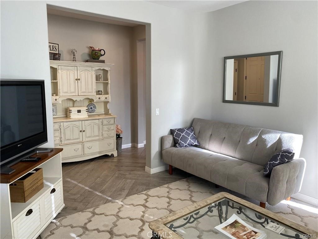 23 Bedstraw Loop Ladera Ranch, CA 92694 - Photo 14 of 37 a living room with furniture and a flat screen tv