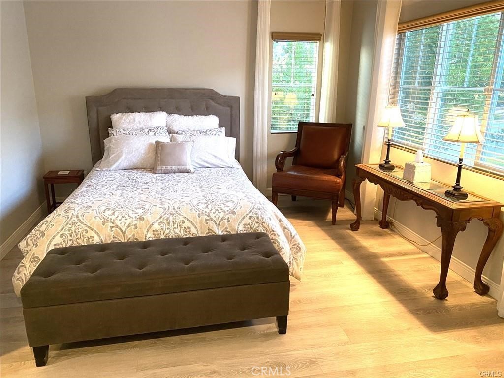 23 Bedstraw Loop Ladera Ranch, CA 92694 - Photo 17 of 37 a bedroom with a bed and wooden floor