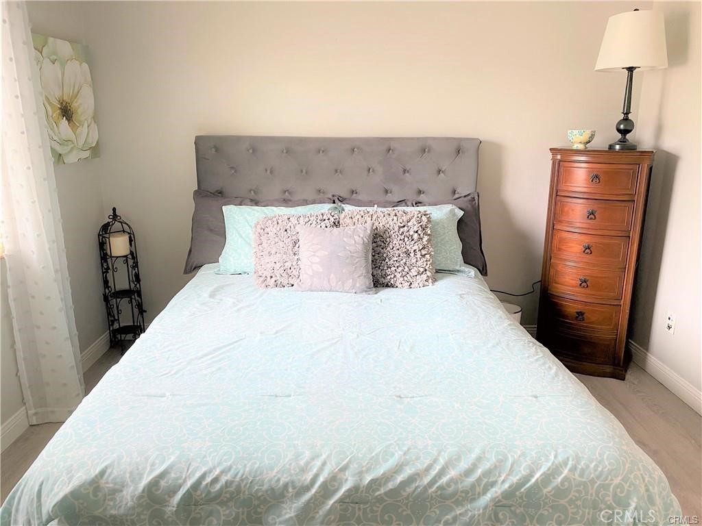 23 Bedstraw Loop Ladera Ranch, CA 92694 - Photo 22 of 37 a bedroom with a bed and a mirror