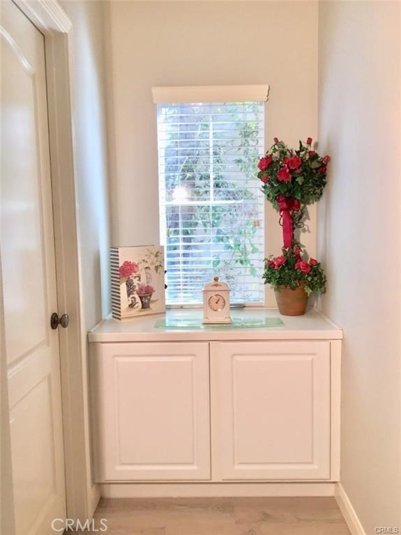 23 Bedstraw Loop Ladera Ranch, CA 92694 - Photo 25 of 37 a vase of flowers sitting on a shelf