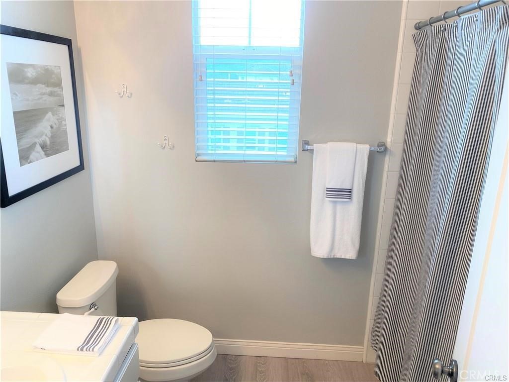 23 Bedstraw Loop Ladera Ranch, CA 92694 - Photo 27 of 37 a white toilet sitting next to a bathroom sink