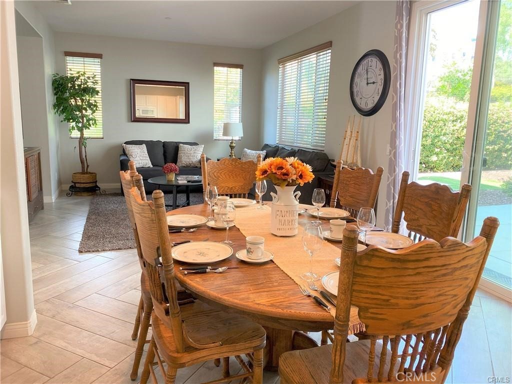 23 Bedstraw Loop Ladera Ranch, CA 92694 - Photo 3 of 37 a view of a dining room with furniture window and wooden floor