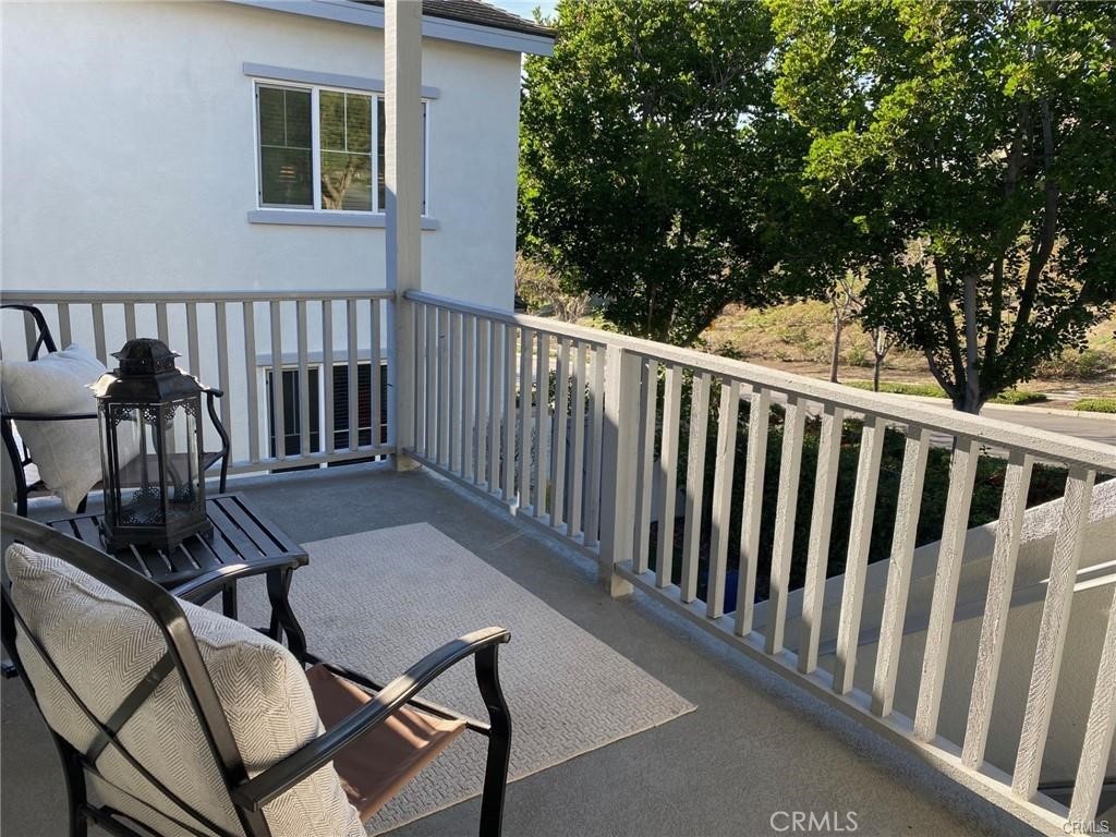 23 Bedstraw Loop Ladera Ranch, CA 92694 - Photo 33 of 37 a view of a chairs and table in the balcony