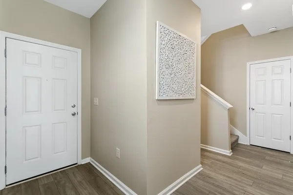an empty room with wooden floor