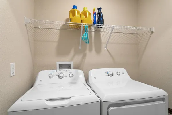a utility room with dryer and washer
