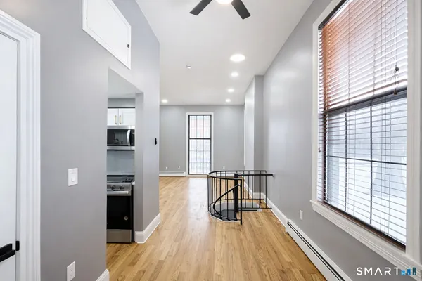 a view of dining room with furniture and wooden floor