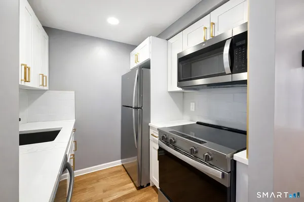 a kitchen with a stove and a microwave
