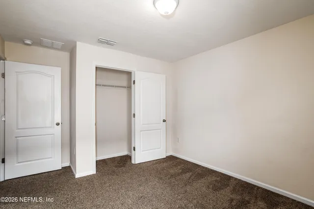 an empty room with closet