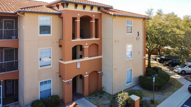 an aerial view of residential houses and outdoor space