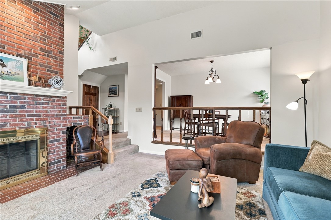 7 Woodbridge Circle Anderson, SC 29621 - Photo 7 of 26 An impressive floor-to-ceiling brick fireplace anchors this spacious room with vaulted ceilings.