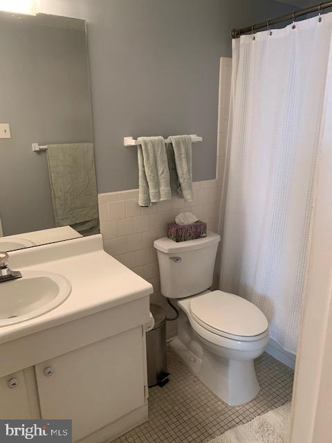 116 Cross Keys Road, Unit A A Baltimore, MD 21210 - Photo 11 of 15 a bathroom with a sink and a toilet