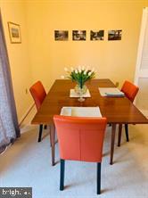 116 Cross Keys Road, Unit A A Baltimore, MD 21210 - Photo 4 of 15 a dining room with furniture and a table